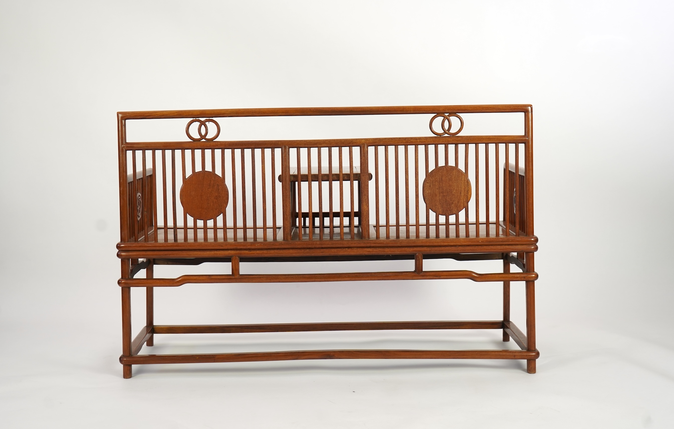 A Chinese hardwood and burrwood inset spindle-back bench, early 20th century